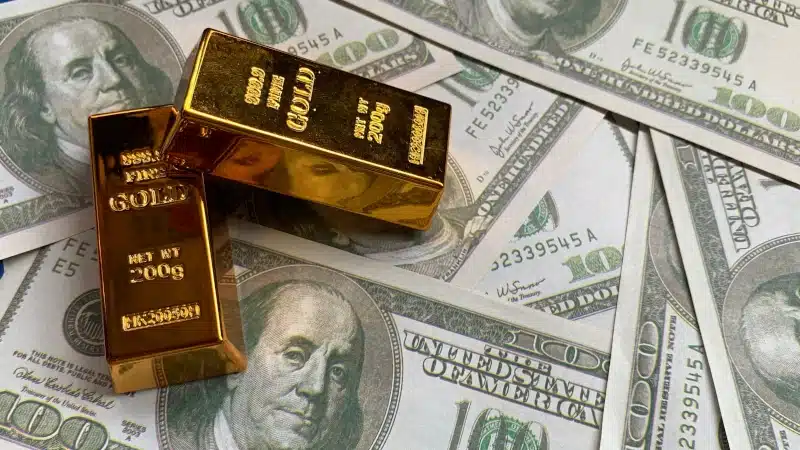 gold bars on $100 bills