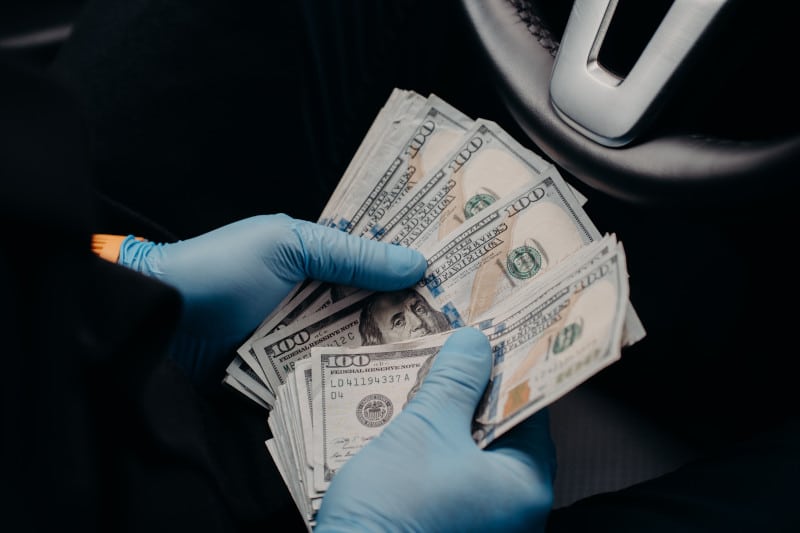 handling cash with gloves