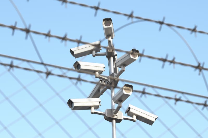 cameras and barbed wire for security