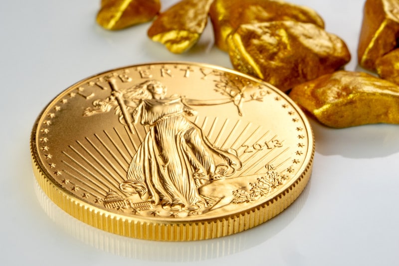 Gold American Eagle coin with gold nuggets