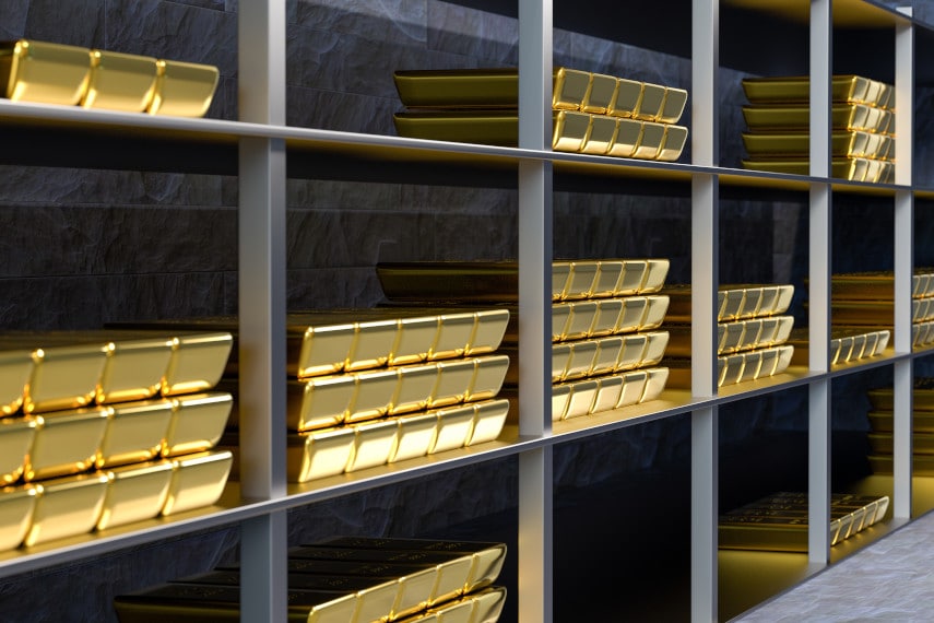gold bars stacked in a vault
