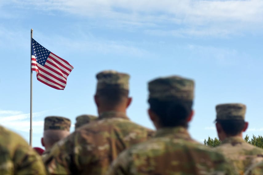 US troops in front of US flag