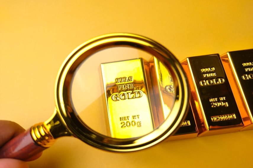 Gold bars thru magnifying lens
